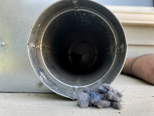 Westerville Dryer Vent Cleaning technician using specialized equipment to clear severe dryer vent blockage in Westerville